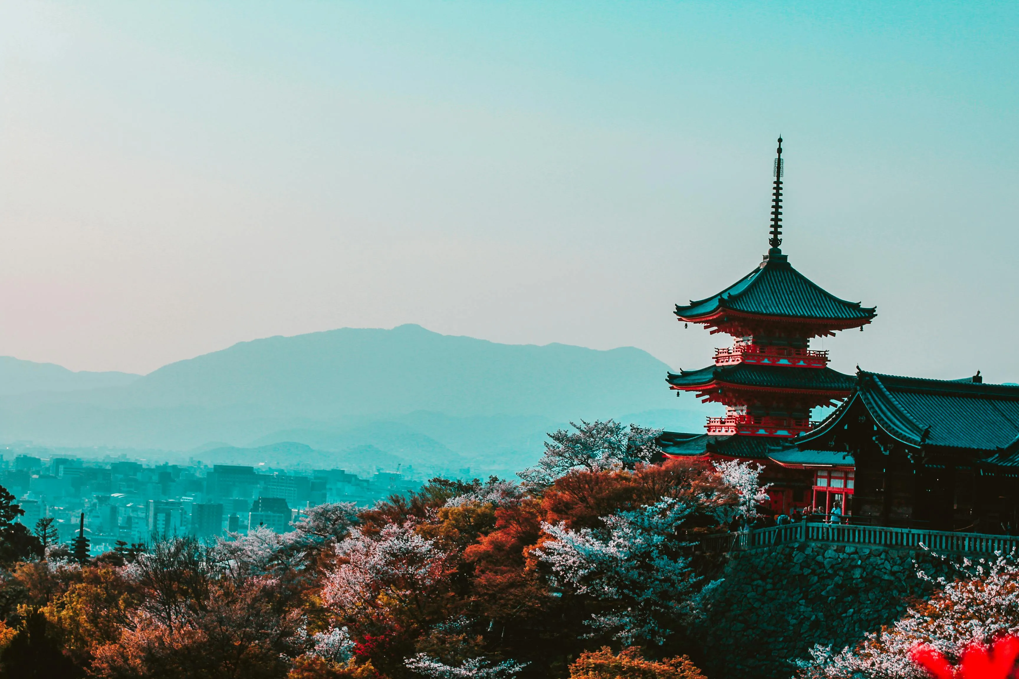 Kyoto pagoda at sunset with autumn foliage